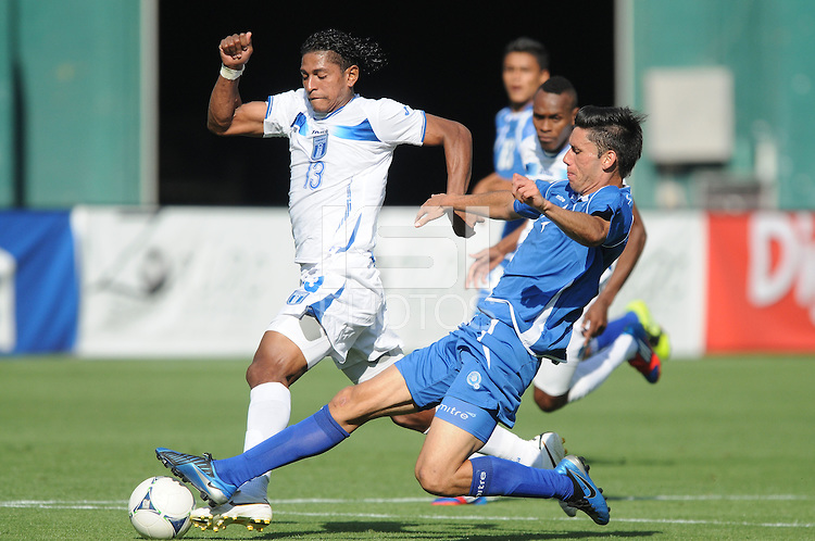 El Salvador defender Steve Purdy (4) goes against Honduras forward Carlos Costly (13) Honduras National Team defeated El Salvador 3-0 at RFK stadium, Saturday June 2, 2012.